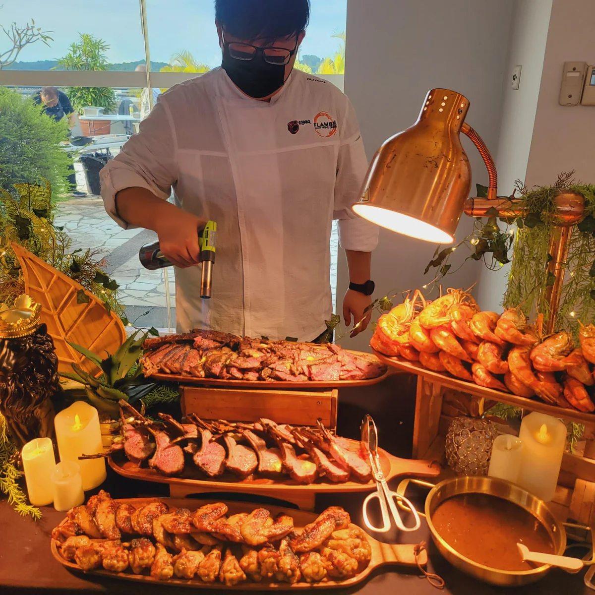EZBBQ chef grilling live at a LiveGrill buffet